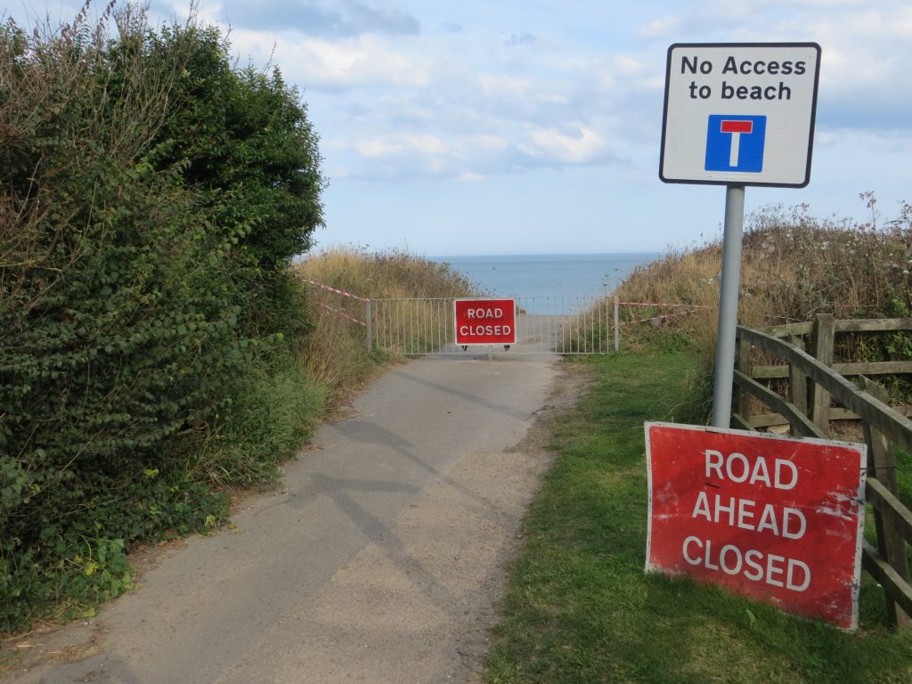 Coastal erosion: the end of the road. Photo by Stephen McNair.