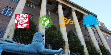 Exterior photo of Norwich City Hall with political party logos superimposed