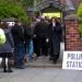People queuing outside a polling station