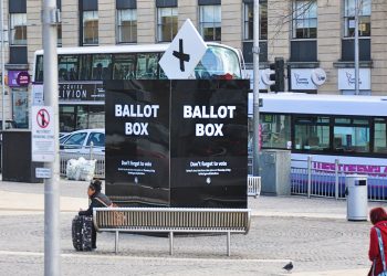 A huge 'ballot box' on the street, saying "don't forget to vote"