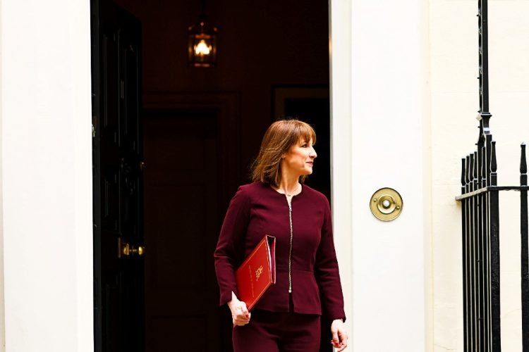 Rachel Reeves exiting No11 with a red folder on the day of the Spring Statement