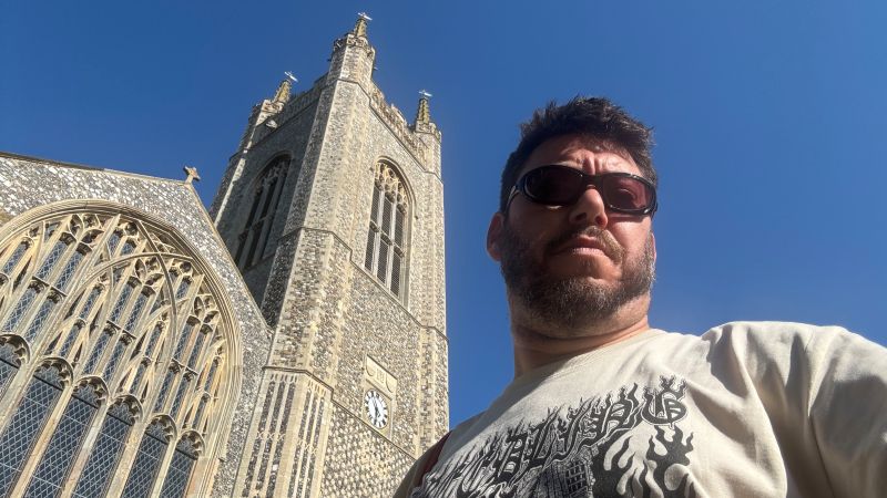 Selfie of Chris Spalton against Bungay church