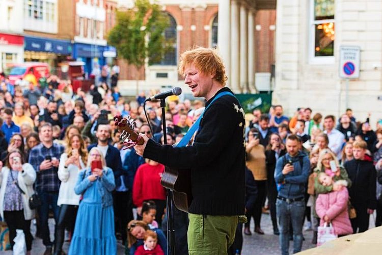 Local superstar Ed Sheeran playing a surprise concert on the steps of Ipswich town hall